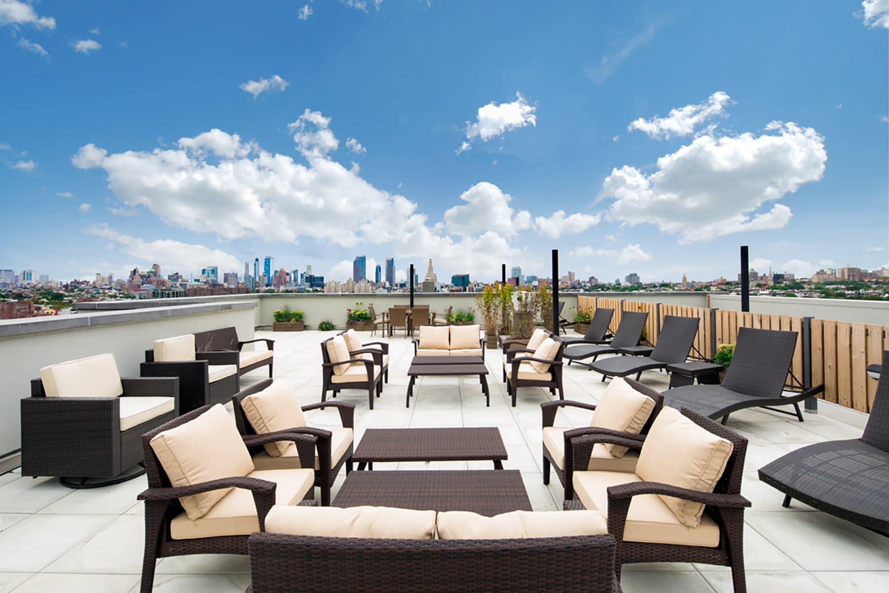 Beautiful Rooftop Deck with BBQ Grills and Seating