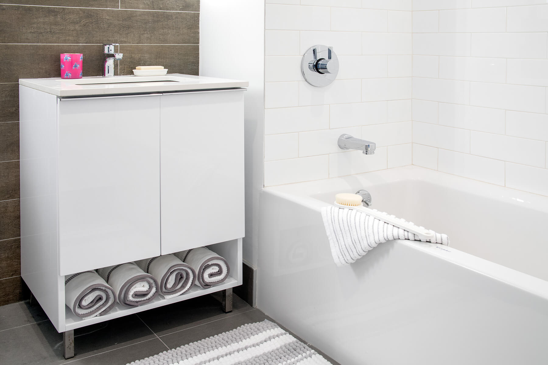 Contemporary Bathroom Detail with White Subway Tiled Shower Bath and Chrome Fixtures